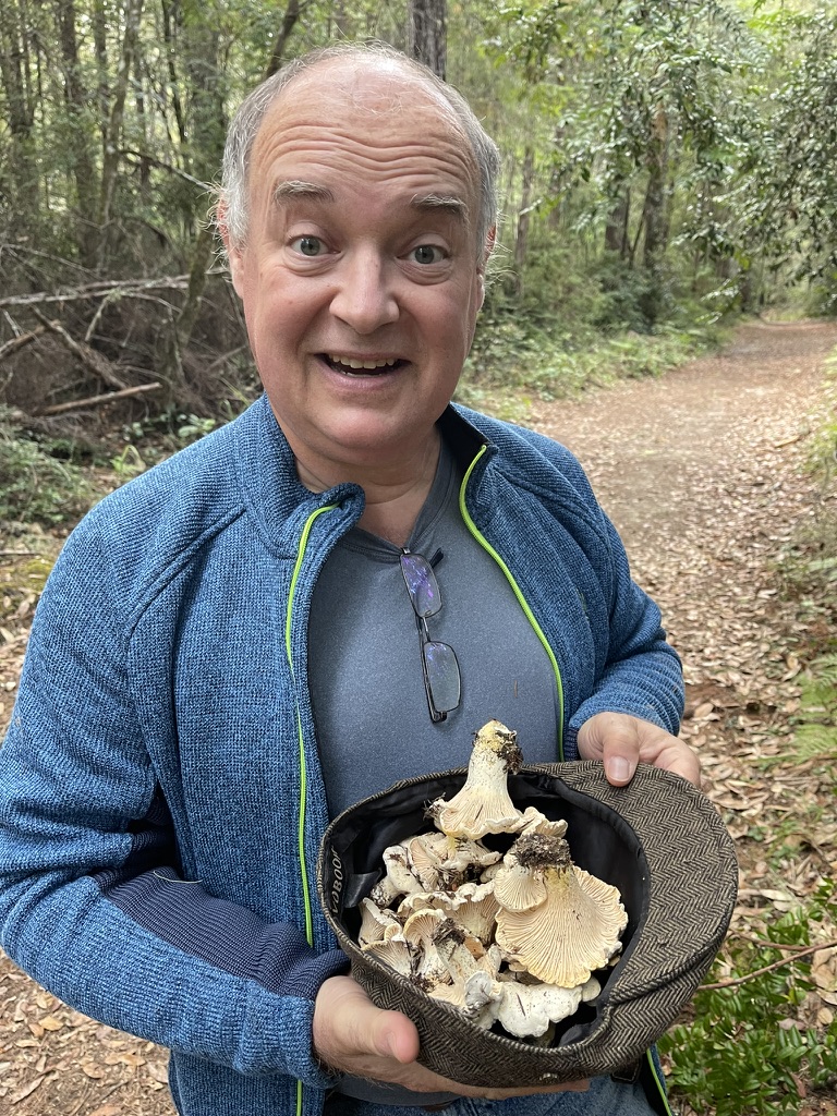 Jerome with a haul of golden chanterelles in the coastal forest